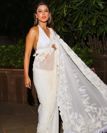 Nia Sharma looks irresistible in a white see through saree