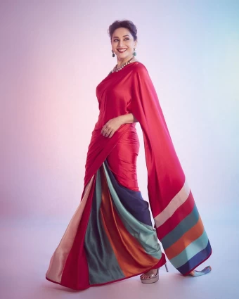 Madhuri Dixit looks astounding in the red silk saree