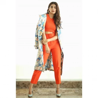 Pooja Hegde looks statusque in the orange co-ords and long jacket.