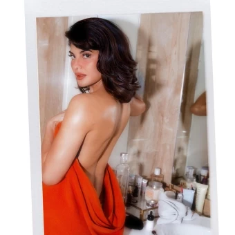 Jacqueline Fernandez has gone backless, wrapping herself in a red cloth