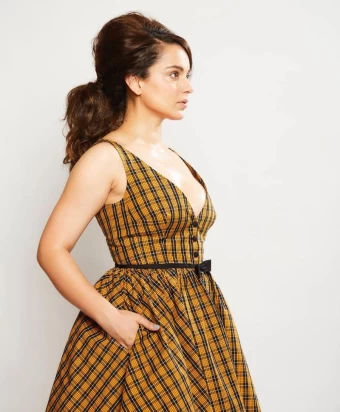 Kangana also shared some pictures where she is seen wearing a chic checkered dress from Miu Miu.