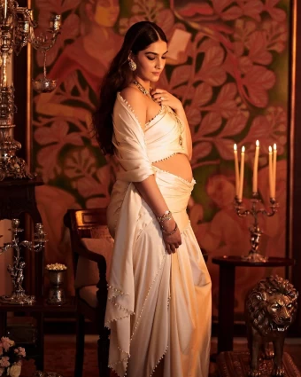 Sonam Kapoor Flaunts Baby Bump Draped In Ivory Saree