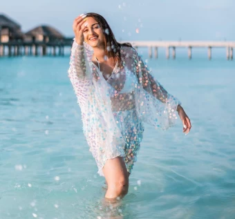 Sonakshi Sinha looks stunning in the whit bikini with a glittering shrug