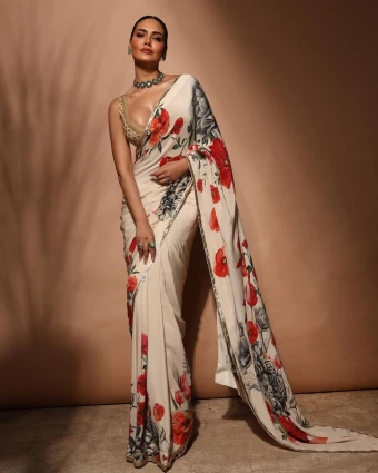 Esha Gupta cuts a striking figure in a floral white saree