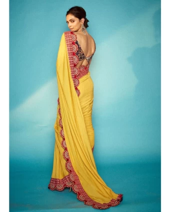 Deepika Padukone casts a spell draped in the yellow saree with a scalloped border.