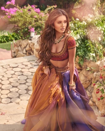 Tara Sutaria looks mesmerising in the brown and purple lehenga