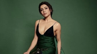 actress samantha ruth prabhu is posing for a photo sitting in green wall background wearing black green design dress hd girls