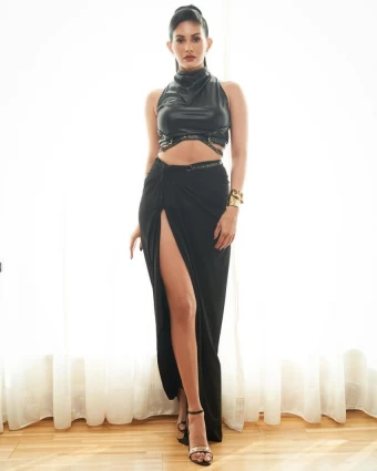 Amyra Dastur looks edgy in the black bralette and high-slit wrap skirt
