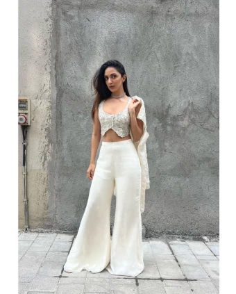 Kiara Advani looks chic in the white bralette and wide-legged pants.