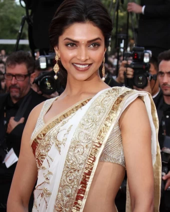 Deepika Padukone made a splash at Cannes in her debut year wearing a white and golden saree