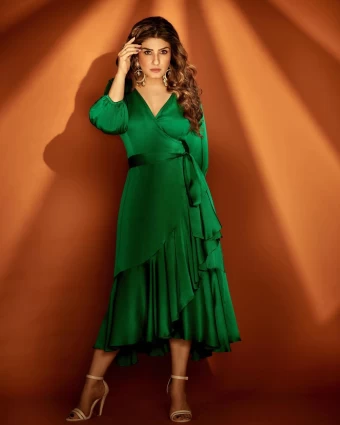 Raveena Tandon looks spectacular in the green midi dress.