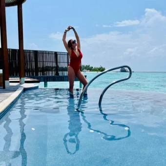 Lindsay enjoyed a picturesque trip to the Maldives and stunned in a scarlet red bathing suit