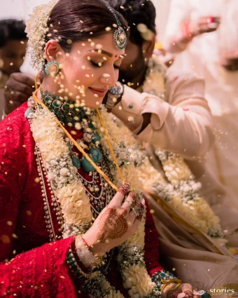 A beautiful capture of Nayanthara as the mangalsutra is tied around her neck