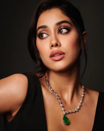 Janhvi Kapoor accessorisses her outfit with a statement diamond neckpiece.