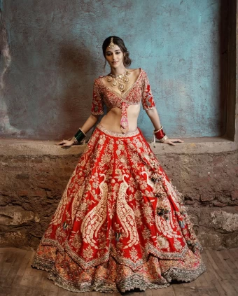 Ananya Panday gives bridal feels in the ornate red lehenga.