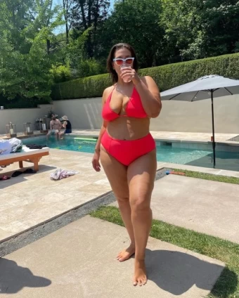 Ashley Graham sizzles in a bikini on a hot summer day.