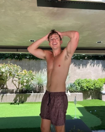Charlie Puth poses wet and shirtless for the 'gram.
