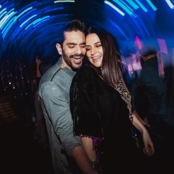 In this post, Neha is seen having a fun time with her husband, Angad Bedi, where they are grooving and are all smiles for the camera