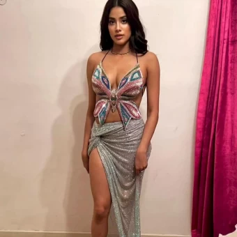 Janhvi Kapoor looks gorgeous in a butterfly top and wrapped skirt, both in sequins.