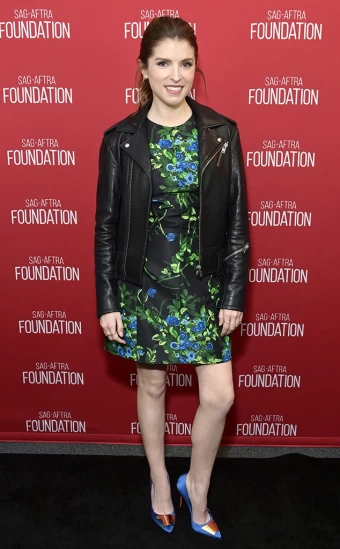 Actress Anna Kendrick opts for a floral dress, leather jacket and periwinkle pointed heels