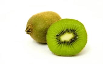 Crisp Hd Photo Of A Whole And Sliced Kiwi Fruit Displayed From A White Surface