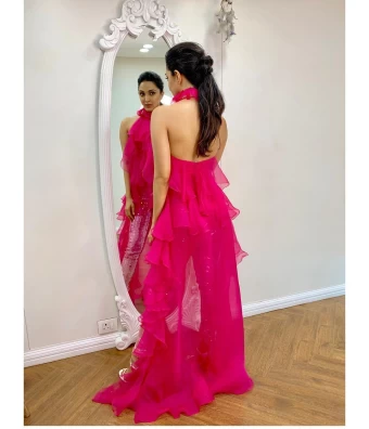 Kiara Advani looks stunning in a vibrant pink backless dress