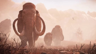 Group Of Mammoths Trekking Through The Dusty Terrain