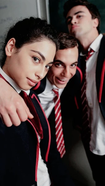 wonderful selfie of Nadia, Christian and Samuel from Elite Netflix series wearing their red, white and black uniform