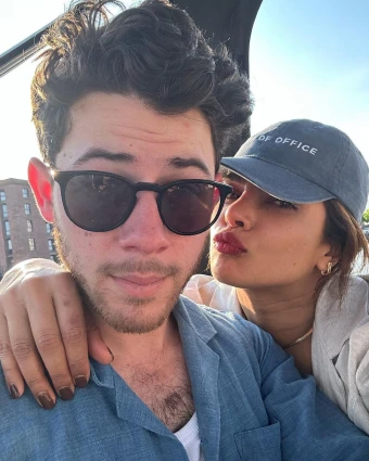 Priyanka Chopra leans in to give Nick Jonas a smooch