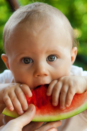 baby bite boy child cute eat eating food fruit 4k wallpaper