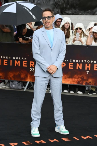 Robert Downey Jr. looked cool and casual in this light blue suit with a pair of blue sneakers & sunglasses at an ‘Oppenheimer’ film photocall in London