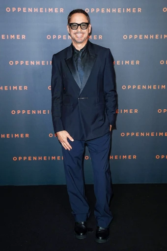 Robert Downey Jr opted for an all-dark ensemble at the ‘Oppenheimer’ premiere in Paris, France, on Tuesday. The ‘Iron Man’ actor flashed his intimitable smile, as well.