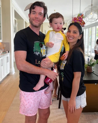 TWO FOR THE SHOW: For son Malcolm's second birthday, parents John Mulaney (left) and Olivia Munn put on their best silly headpieces.