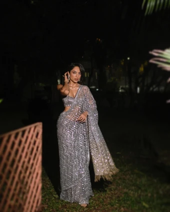 Sobhita Dhulipala looks about goddess like in this Silver Saree. Sobhita Dhulipala's silver sequined saree is a perfect example of a modern spin on traditional dressing. It featured glitter, and shimmery sequins as the actress teamed it with a sleek blouse.