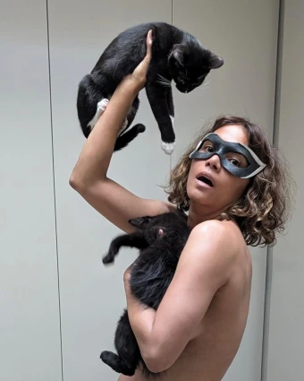 In the snaps, the “Gothika” star ditched her top, wearing only black underwear and a black cat eye mask.