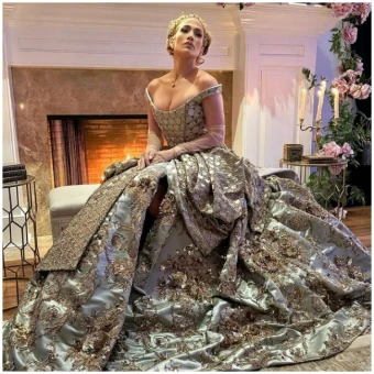 Jennifer Lopez' off shoulder gown looks elite and opulent with every thread and crystal.