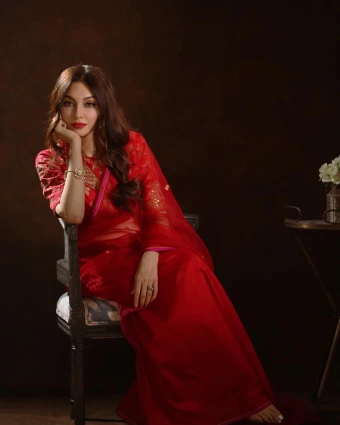 A moment of serene beauty: Saumya Tandon showcases the timeless charm of a red sari, embracing her cultural heritage.