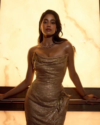 Janhvi Kapoor captivates in a sculpted golden gown, perfectly accentuating her figure and making her shine like a golden goddess.