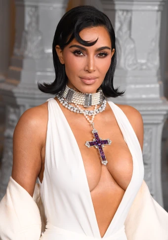 Kim Kardashian paired Princess Diana’s amethyst cross with a plunging white gown to the LACMA Art+Film Gala on Saturday night.