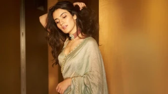 She appeared peaceful in this jade green tissue saree with fine hand embroidery, done very minimally for a carefree summer look, and complemented with a bold statement blouse.