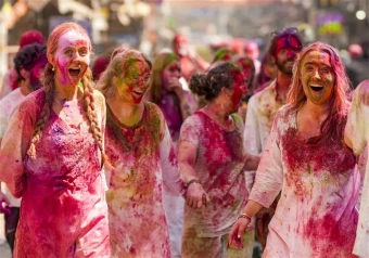 Foreign tourists participate in Holi celebrations along with locals in Paharganj, in New Delhi  Read more at: https://www.oneindia.com/photo-gallery/holi-2025-colors-smiles-and-festive-bliss-across-india-122293.html?ref_source=OI-EN&ref_medium=Home-Page&ref_campaign=OI-Photo-Widget#photos-2