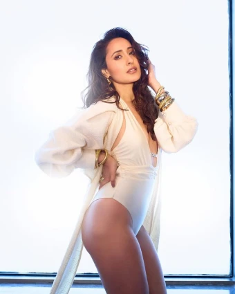 Pragya pairs the monokini with a matching white cape that adds drama to the ensemble