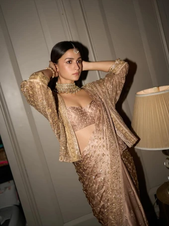 Alia Bhatt: The actor stunned in a vintage rose gold saree with matching blouse and jacket.
