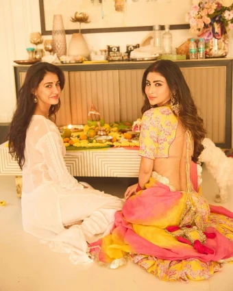 Disha Patani and Mouni Roy: While Disha looked pretty in a simple white kurta set, Mouni opted for a vibrant floral lehenga choli.