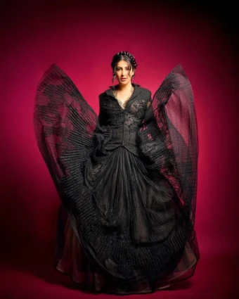 Shruti Haasan made a bold fashion statement with her choice of an exquisite black gown, showcasing her unique style and confidence.
