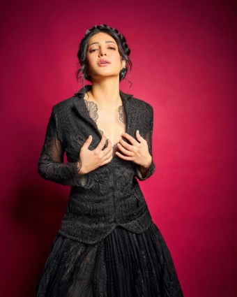 Shruti Haasan's bold and enchanting black gown solidifies her status as a fashion icon, inspiring many with her daring and stylish choices.