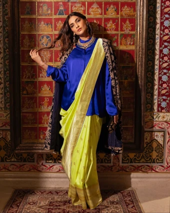 Sonam Kapoor: Sonam shone bright in a bright yellow saree, which she paired with a blue silk shirt