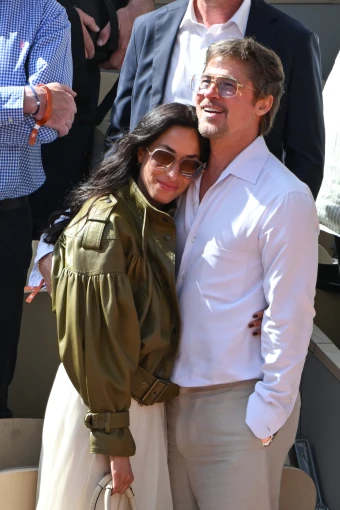 Brad Pitt and Ines de Ramon cuddle up while attending the women’s final during the 2026 French Open