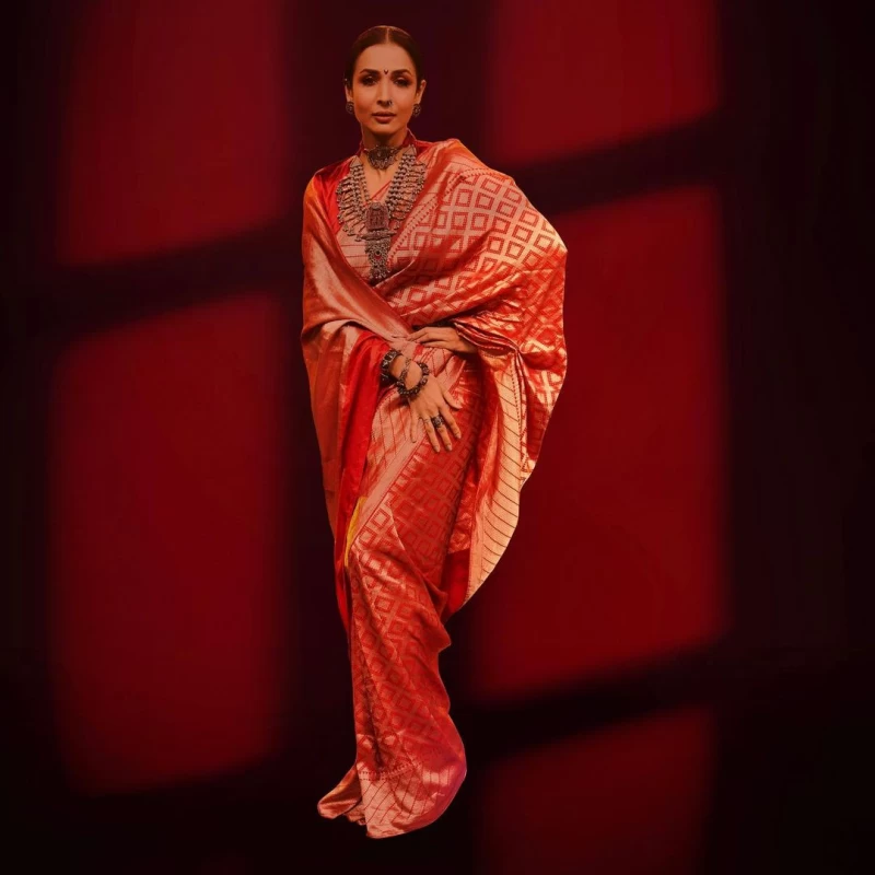 Malaika Arora looks traditional in the red and golden saree
