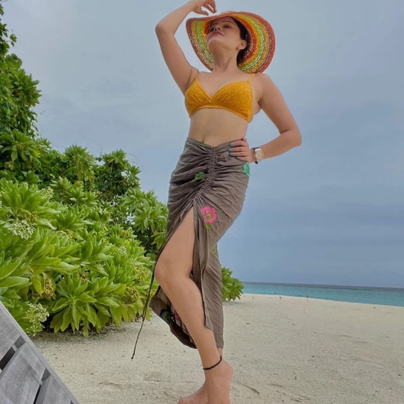 Rubina Dilaik looks flawless in the yellow bikini top and ruched sarong